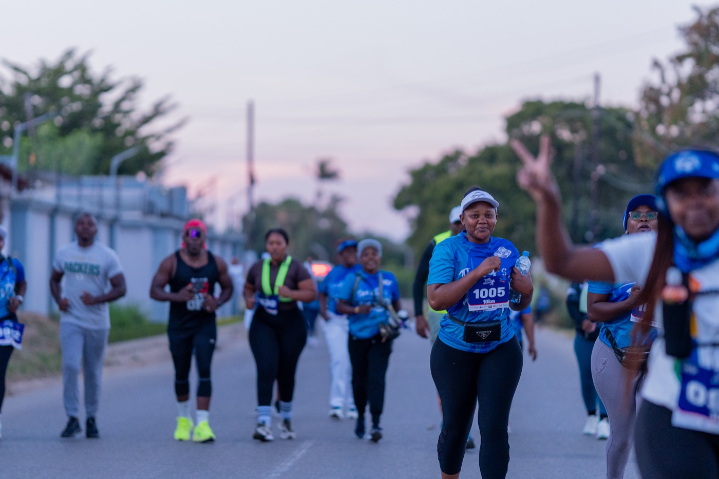 Runners smiling mid-race