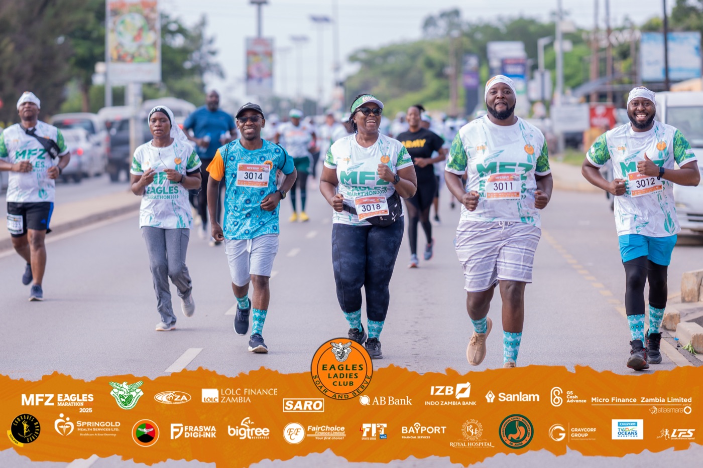 Runners smiling along the route
